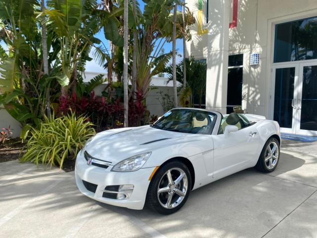 2007 Polar White /Tan Saturn Sky LOW MILES 21,329 5 SPEED MANUAL (1G8MB35B47Y) with an 2.4L DOHC VVT I4 Aluminum Ecotec Engine engine, Manual transmission, located at 4701 North Dixie Hwy, Pompano Beach, FL, 33064, (954) 422-2889, 26.240938, -80.123474 - OUR WEBPAGE FLORIDACARS1.COM HAS OVER 100 PHOTOS AND FREE CARFAX LINK 2007 Saturn SKY 5 SPEED MANUAL Convertible 2.4L I4 F DOHC Gasoline 28 MPG Rear Wheel Drive Features ABS Brakes Air Conditioning Alloy Wheels AM/FM Stereo Auxiliary Audio Input CD Audio Cruise Control Leather Seats Manual Transmiss - Photo#38