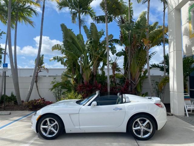2007 Polar White /Tan Saturn Sky LOW MILES 21,329 5 SPEED MANUAL (1G8MB35B47Y) with an 2.4L DOHC VVT I4 Aluminum Ecotec Engine engine, Manual transmission, located at 4701 North Dixie Hwy, Pompano Beach, FL, 33064, (954) 422-2889, 26.240938, -80.123474 - OUR WEBPAGE FLORIDACARS1.COM HAS OVER 100 PHOTOS AND FREE CARFAX LINK 2007 Saturn SKY 5 SPEED MANUAL Convertible 2.4L I4 F DOHC Gasoline 28 MPG Rear Wheel Drive Features ABS Brakes Air Conditioning Alloy Wheels AM/FM Stereo Auxiliary Audio Input CD Audio Cruise Control Leather Seats Manual Transmiss - Photo#40
