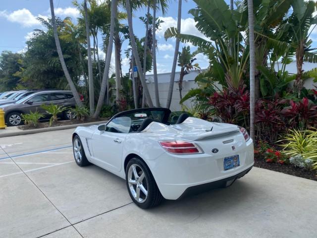 2007 Polar White /Tan Saturn Sky LOW MILES 21,329 5 SPEED MANUAL (1G8MB35B47Y) with an 2.4L DOHC VVT I4 Aluminum Ecotec Engine engine, Manual transmission, located at 4701 North Dixie Hwy, Pompano Beach, FL, 33064, (954) 422-2889, 26.240938, -80.123474 - OUR WEBPAGE FLORIDACARS1.COM HAS OVER 100 PHOTOS AND FREE CARFAX LINK 2007 Saturn SKY 5 SPEED MANUAL Convertible 2.4L I4 F DOHC Gasoline 28 MPG Rear Wheel Drive Features ABS Brakes Air Conditioning Alloy Wheels AM/FM Stereo Auxiliary Audio Input CD Audio Cruise Control Leather Seats Manual Transmiss - Photo#42