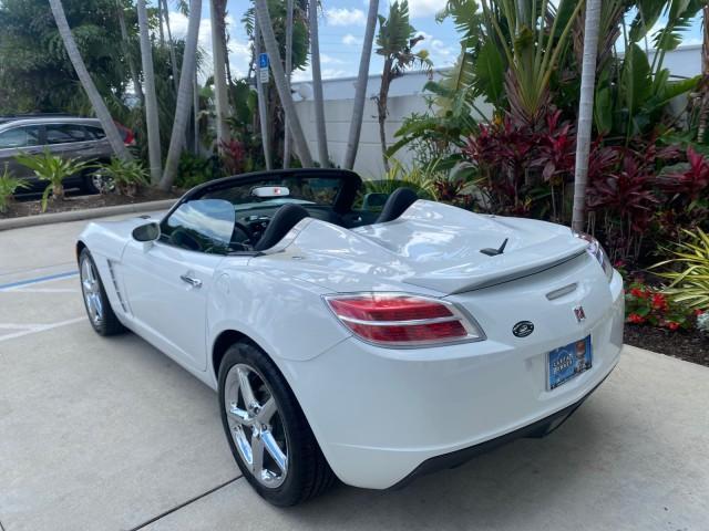 2007 Polar White /Tan Saturn Sky LOW MILES 21,329 5 SPEED MANUAL (1G8MB35B47Y) with an 2.4L DOHC VVT I4 Aluminum Ecotec Engine engine, Manual transmission, located at 4701 North Dixie Hwy, Pompano Beach, FL, 33064, (954) 422-2889, 26.240938, -80.123474 - OUR WEBPAGE FLORIDACARS1.COM HAS OVER 100 PHOTOS AND FREE CARFAX LINK 2007 Saturn SKY 5 SPEED MANUAL Convertible 2.4L I4 F DOHC Gasoline 28 MPG Rear Wheel Drive Features ABS Brakes Air Conditioning Alloy Wheels AM/FM Stereo Auxiliary Audio Input CD Audio Cruise Control Leather Seats Manual Transmiss - Photo#43