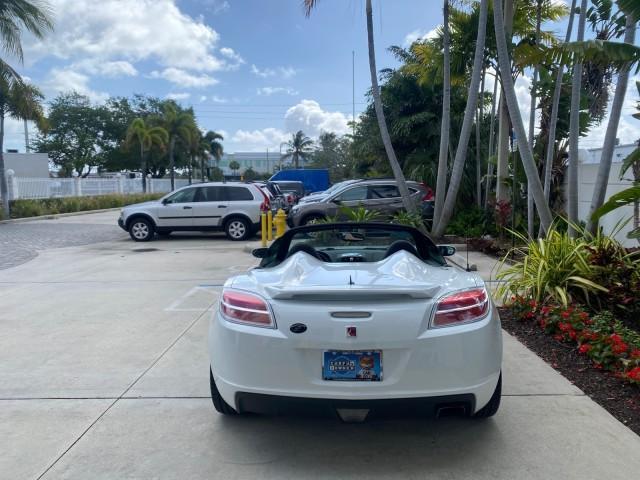 2007 Polar White /Tan Saturn Sky LOW MILES 21,329 5 SPEED MANUAL (1G8MB35B47Y) with an 2.4L DOHC VVT I4 Aluminum Ecotec Engine engine, Manual transmission, located at 4701 North Dixie Hwy, Pompano Beach, FL, 33064, (954) 422-2889, 26.240938, -80.123474 - OUR WEBPAGE FLORIDACARS1.COM HAS OVER 100 PHOTOS AND FREE CARFAX LINK 2007 Saturn SKY 5 SPEED MANUAL Convertible 2.4L I4 F DOHC Gasoline 28 MPG Rear Wheel Drive Features ABS Brakes Air Conditioning Alloy Wheels AM/FM Stereo Auxiliary Audio Input CD Audio Cruise Control Leather Seats Manual Transmiss - Photo#44