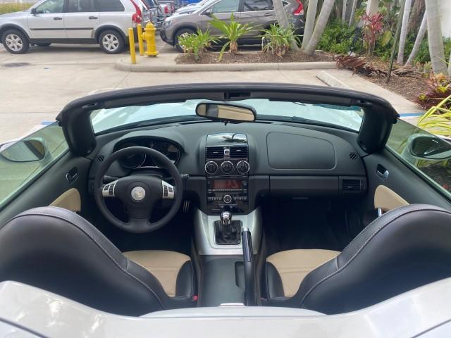 2007 Polar White /Tan Saturn Sky LOW MILES 21,329 5 SPEED MANUAL (1G8MB35B47Y) with an 2.4L DOHC VVT I4 Aluminum Ecotec Engine engine, Manual transmission, located at 4701 North Dixie Hwy, Pompano Beach, FL, 33064, (954) 422-2889, 26.240938, -80.123474 - OUR WEBPAGE FLORIDACARS1.COM HAS OVER 100 PHOTOS AND FREE CARFAX LINK 2007 Saturn SKY 5 SPEED MANUAL Convertible 2.4L I4 F DOHC Gasoline 28 MPG Rear Wheel Drive Features ABS Brakes Air Conditioning Alloy Wheels AM/FM Stereo Auxiliary Audio Input CD Audio Cruise Control Leather Seats Manual Transmiss - Photo#46