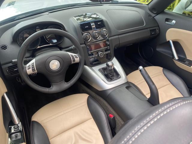 2007 Polar White /Tan Saturn Sky LOW MILES 21,329 5 SPEED MANUAL (1G8MB35B47Y) with an 2.4L DOHC VVT I4 Aluminum Ecotec Engine engine, Manual transmission, located at 4701 North Dixie Hwy, Pompano Beach, FL, 33064, (954) 422-2889, 26.240938, -80.123474 - OUR WEBPAGE FLORIDACARS1.COM HAS OVER 100 PHOTOS AND FREE CARFAX LINK 2007 Saturn SKY 5 SPEED MANUAL Convertible 2.4L I4 F DOHC Gasoline 28 MPG Rear Wheel Drive Features ABS Brakes Air Conditioning Alloy Wheels AM/FM Stereo Auxiliary Audio Input CD Audio Cruise Control Leather Seats Manual Transmiss - Photo#47