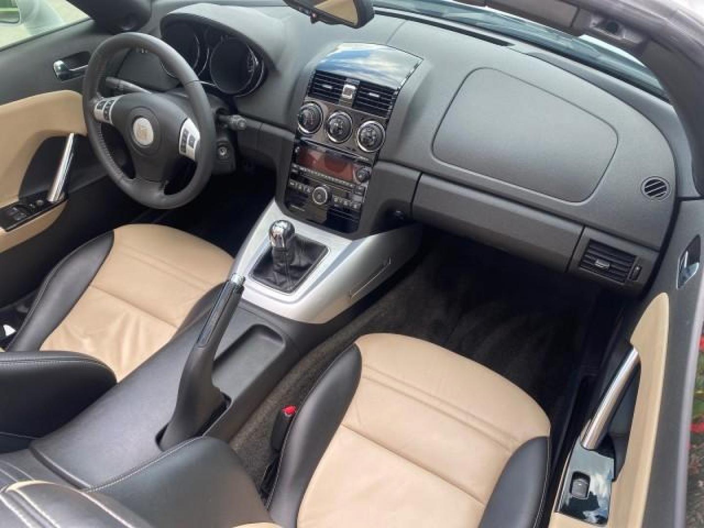 2007 Polar White /Tan Saturn Sky LOW MILES 21,329 5 SPEED MANUAL (1G8MB35B47Y) with an 2.4L DOHC VVT I4 Aluminum Ecotec Engine engine, Manual transmission, located at 4701 North Dixie Hwy, Pompano Beach, FL, 33064, (954) 422-2889, 26.240938, -80.123474 - OUR WEBPAGE FLORIDACARS1.COM HAS OVER 100 PHOTOS AND FREE CARFAX LINK 2007 Saturn SKY 5 SPEED MANUAL Convertible 2.4L I4 F DOHC Gasoline 28 MPG Rear Wheel Drive Features ABS Brakes Air Conditioning Alloy Wheels AM/FM Stereo Auxiliary Audio Input CD Audio Cruise Control Leather Seats Manual Transmiss - Photo#49