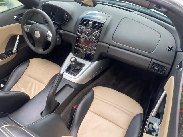 2007 Polar White /Tan Saturn Sky LOW MILES 21,329 5 SPEED MANUAL (1G8MB35B47Y) with an 2.4L DOHC VVT I4 Aluminum Ecotec Engine engine, Manual transmission, located at 4701 North Dixie Hwy, Pompano Beach, FL, 33064, (954) 422-2889, 26.240938, -80.123474 - OUR WEBPAGE FLORIDACARS1.COM HAS OVER 100 PHOTOS AND FREE CARFAX LINK 2007 Saturn SKY 5 SPEED MANUAL Convertible 2.4L I4 F DOHC Gasoline 28 MPG Rear Wheel Drive Features ABS Brakes Air Conditioning Alloy Wheels AM/FM Stereo Auxiliary Audio Input CD Audio Cruise Control Leather Seats Manual Transmiss - Photo#49