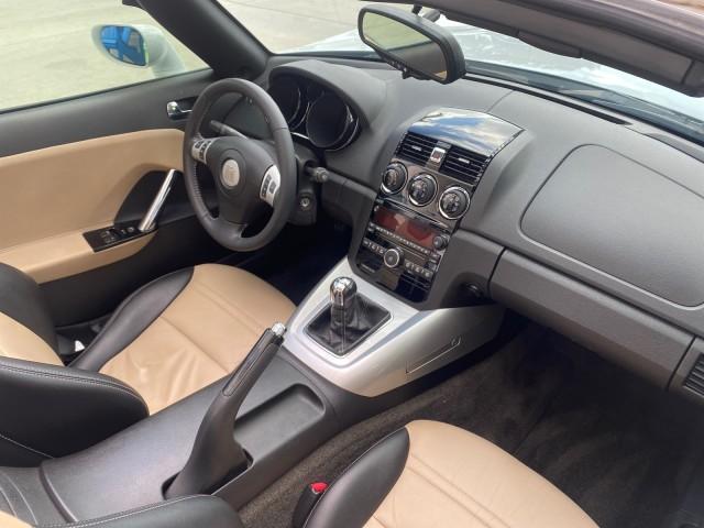 2007 Polar White /Tan Saturn Sky LOW MILES 21,329 5 SPEED MANUAL (1G8MB35B47Y) with an 2.4L DOHC VVT I4 Aluminum Ecotec Engine engine, Manual transmission, located at 4701 North Dixie Hwy, Pompano Beach, FL, 33064, (954) 422-2889, 26.240938, -80.123474 - OUR WEBPAGE FLORIDACARS1.COM HAS OVER 100 PHOTOS AND FREE CARFAX LINK 2007 Saturn SKY 5 SPEED MANUAL Convertible 2.4L I4 F DOHC Gasoline 28 MPG Rear Wheel Drive Features ABS Brakes Air Conditioning Alloy Wheels AM/FM Stereo Auxiliary Audio Input CD Audio Cruise Control Leather Seats Manual Transmiss - Photo#50