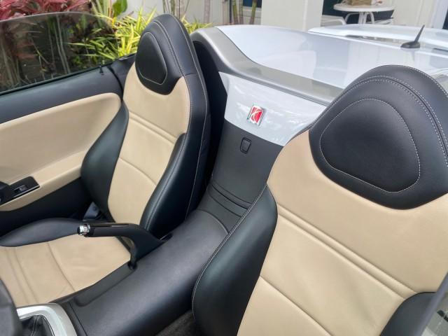 2007 Polar White /Tan Saturn Sky LOW MILES 21,329 5 SPEED MANUAL (1G8MB35B47Y) with an 2.4L DOHC VVT I4 Aluminum Ecotec Engine engine, Manual transmission, located at 4701 North Dixie Hwy, Pompano Beach, FL, 33064, (954) 422-2889, 26.240938, -80.123474 - OUR WEBPAGE FLORIDACARS1.COM HAS OVER 100 PHOTOS AND FREE CARFAX LINK 2007 Saturn SKY 5 SPEED MANUAL Convertible 2.4L I4 F DOHC Gasoline 28 MPG Rear Wheel Drive Features ABS Brakes Air Conditioning Alloy Wheels AM/FM Stereo Auxiliary Audio Input CD Audio Cruise Control Leather Seats Manual Transmiss - Photo#52