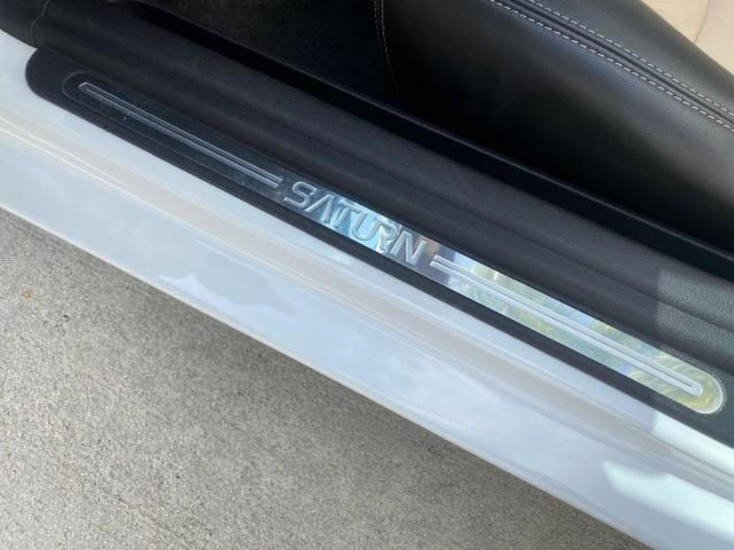 2007 Polar White /Tan Saturn Sky LOW MILES 21,329 5 SPEED MANUAL (1G8MB35B47Y) with an 2.4L DOHC VVT I4 Aluminum Ecotec Engine engine, Manual transmission, located at 4701 North Dixie Hwy, Pompano Beach, FL, 33064, (954) 422-2889, 26.240938, -80.123474 - OUR WEBPAGE FLORIDACARS1.COM HAS OVER 100 PHOTOS AND FREE CARFAX LINK 2007 Saturn SKY 5 SPEED MANUAL Convertible 2.4L I4 F DOHC Gasoline 28 MPG Rear Wheel Drive Features ABS Brakes Air Conditioning Alloy Wheels AM/FM Stereo Auxiliary Audio Input CD Audio Cruise Control Leather Seats Manual Transmiss - Photo#59