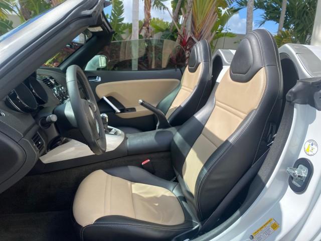 2007 Polar White /Tan Saturn Sky LOW MILES 21,329 5 SPEED MANUAL (1G8MB35B47Y) with an 2.4L DOHC VVT I4 Aluminum Ecotec Engine engine, Manual transmission, located at 4701 North Dixie Hwy, Pompano Beach, FL, 33064, (954) 422-2889, 26.240938, -80.123474 - OUR WEBPAGE FLORIDACARS1.COM HAS OVER 100 PHOTOS AND FREE CARFAX LINK 2007 Saturn SKY 5 SPEED MANUAL Convertible 2.4L I4 F DOHC Gasoline 28 MPG Rear Wheel Drive Features ABS Brakes Air Conditioning Alloy Wheels AM/FM Stereo Auxiliary Audio Input CD Audio Cruise Control Leather Seats Manual Transmiss - Photo#60