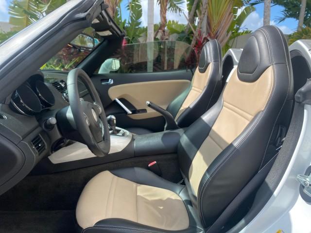 2007 Polar White /Tan Saturn Sky LOW MILES 21,329 5 SPEED MANUAL (1G8MB35B47Y) with an 2.4L DOHC VVT I4 Aluminum Ecotec Engine engine, Manual transmission, located at 4701 North Dixie Hwy, Pompano Beach, FL, 33064, (954) 422-2889, 26.240938, -80.123474 - OUR WEBPAGE FLORIDACARS1.COM HAS OVER 100 PHOTOS AND FREE CARFAX LINK 2007 Saturn SKY 5 SPEED MANUAL Convertible 2.4L I4 F DOHC Gasoline 28 MPG Rear Wheel Drive Features ABS Brakes Air Conditioning Alloy Wheels AM/FM Stereo Auxiliary Audio Input CD Audio Cruise Control Leather Seats Manual Transmiss - Photo#61