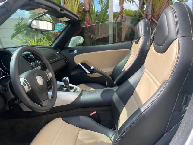 2007 Polar White /Tan Saturn Sky LOW MILES 21,329 5 SPEED MANUAL (1G8MB35B47Y) with an 2.4L DOHC VVT I4 Aluminum Ecotec Engine engine, Manual transmission, located at 4701 North Dixie Hwy, Pompano Beach, FL, 33064, (954) 422-2889, 26.240938, -80.123474 - OUR WEBPAGE FLORIDACARS1.COM HAS OVER 100 PHOTOS AND FREE CARFAX LINK 2007 Saturn SKY 5 SPEED MANUAL Convertible 2.4L I4 F DOHC Gasoline 28 MPG Rear Wheel Drive Features ABS Brakes Air Conditioning Alloy Wheels AM/FM Stereo Auxiliary Audio Input CD Audio Cruise Control Leather Seats Manual Transmiss - Photo#62