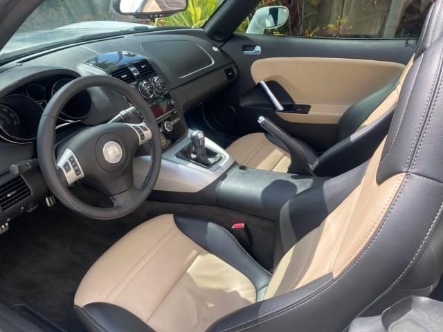 2007 Polar White /Tan Saturn Sky LOW MILES 21,329 5 SPEED MANUAL (1G8MB35B47Y) with an 2.4L DOHC VVT I4 Aluminum Ecotec Engine engine, Manual transmission, located at 4701 North Dixie Hwy, Pompano Beach, FL, 33064, (954) 422-2889, 26.240938, -80.123474 - OUR WEBPAGE FLORIDACARS1.COM HAS OVER 100 PHOTOS AND FREE CARFAX LINK 2007 Saturn SKY 5 SPEED MANUAL Convertible 2.4L I4 F DOHC Gasoline 28 MPG Rear Wheel Drive Features ABS Brakes Air Conditioning Alloy Wheels AM/FM Stereo Auxiliary Audio Input CD Audio Cruise Control Leather Seats Manual Transmiss - Photo#63