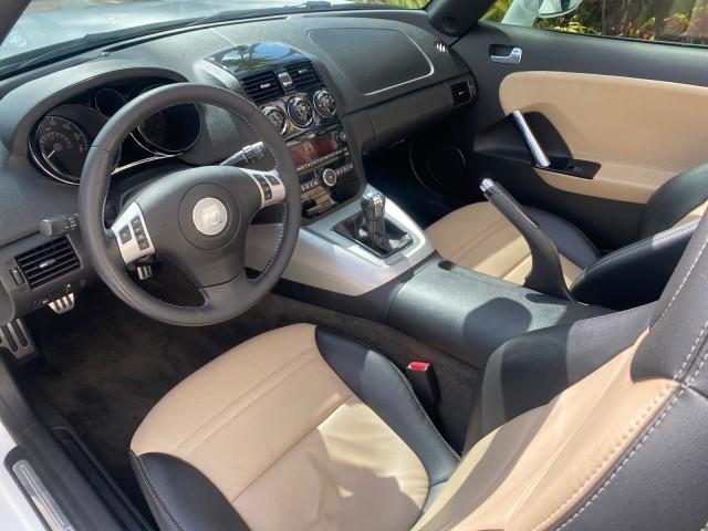 2007 Polar White /Tan Saturn Sky LOW MILES 21,329 5 SPEED MANUAL (1G8MB35B47Y) with an 2.4L DOHC VVT I4 Aluminum Ecotec Engine engine, Manual transmission, located at 4701 North Dixie Hwy, Pompano Beach, FL, 33064, (954) 422-2889, 26.240938, -80.123474 - OUR WEBPAGE FLORIDACARS1.COM HAS OVER 100 PHOTOS AND FREE CARFAX LINK 2007 Saturn SKY 5 SPEED MANUAL Convertible 2.4L I4 F DOHC Gasoline 28 MPG Rear Wheel Drive Features ABS Brakes Air Conditioning Alloy Wheels AM/FM Stereo Auxiliary Audio Input CD Audio Cruise Control Leather Seats Manual Transmiss - Photo#64