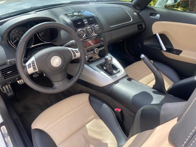 2007 Polar White /Tan Saturn Sky LOW MILES 21,329 5 SPEED MANUAL (1G8MB35B47Y) with an 2.4L DOHC VVT I4 Aluminum Ecotec Engine engine, Manual transmission, located at 4701 North Dixie Hwy, Pompano Beach, FL, 33064, (954) 422-2889, 26.240938, -80.123474 - OUR WEBPAGE FLORIDACARS1.COM HAS OVER 100 PHOTOS AND FREE CARFAX LINK 2007 Saturn SKY 5 SPEED MANUAL Convertible 2.4L I4 F DOHC Gasoline 28 MPG Rear Wheel Drive Features ABS Brakes Air Conditioning Alloy Wheels AM/FM Stereo Auxiliary Audio Input CD Audio Cruise Control Leather Seats Manual Transmiss - Photo#65