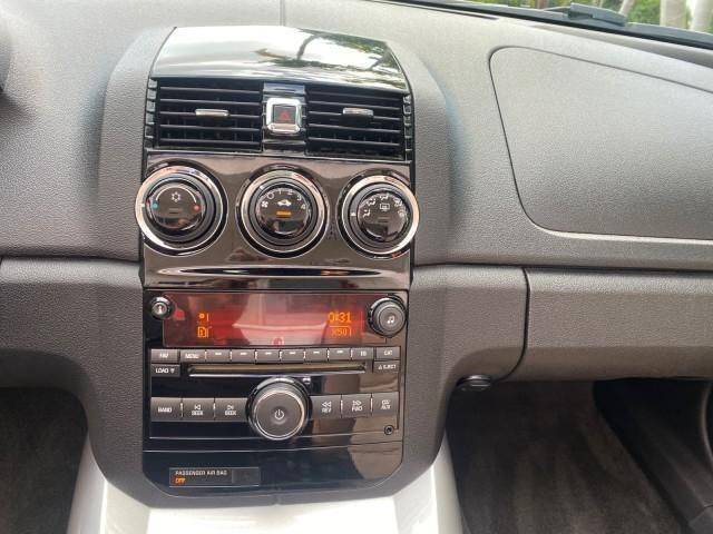 2007 Polar White /Tan Saturn Sky LOW MILES 21,329 5 SPEED MANUAL (1G8MB35B47Y) with an 2.4L DOHC VVT I4 Aluminum Ecotec Engine engine, Manual transmission, located at 4701 North Dixie Hwy, Pompano Beach, FL, 33064, (954) 422-2889, 26.240938, -80.123474 - OUR WEBPAGE FLORIDACARS1.COM HAS OVER 100 PHOTOS AND FREE CARFAX LINK 2007 Saturn SKY 5 SPEED MANUAL Convertible 2.4L I4 F DOHC Gasoline 28 MPG Rear Wheel Drive Features ABS Brakes Air Conditioning Alloy Wheels AM/FM Stereo Auxiliary Audio Input CD Audio Cruise Control Leather Seats Manual Transmiss - Photo#73