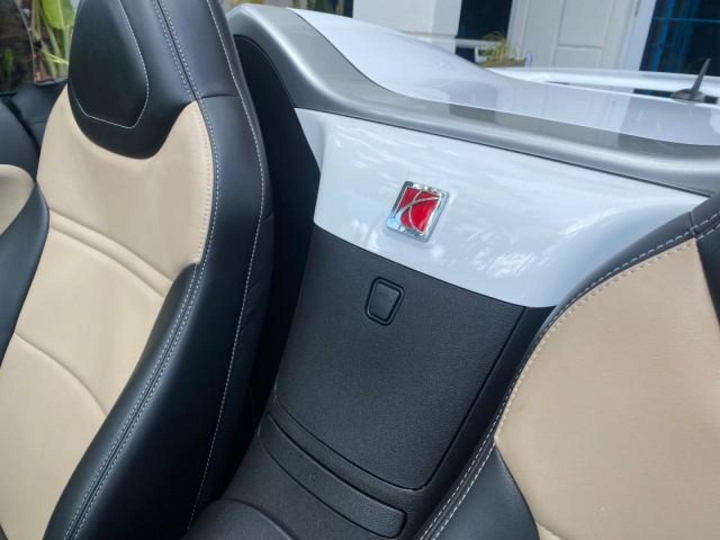 2007 Polar White /Tan Saturn Sky LOW MILES 21,329 5 SPEED MANUAL (1G8MB35B47Y) with an 2.4L DOHC VVT I4 Aluminum Ecotec Engine engine, Manual transmission, located at 4701 North Dixie Hwy, Pompano Beach, FL, 33064, (954) 422-2889, 26.240938, -80.123474 - OUR WEBPAGE FLORIDACARS1.COM HAS OVER 100 PHOTOS AND FREE CARFAX LINK 2007 Saturn SKY 5 SPEED MANUAL Convertible 2.4L I4 F DOHC Gasoline 28 MPG Rear Wheel Drive Features ABS Brakes Air Conditioning Alloy Wheels AM/FM Stereo Auxiliary Audio Input CD Audio Cruise Control Leather Seats Manual Transmiss - Photo#83