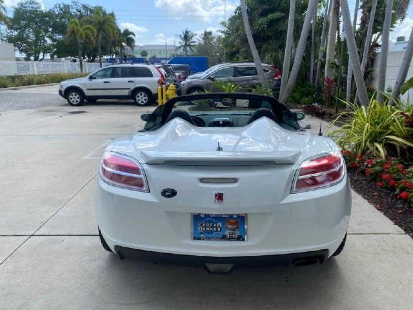 2007 Polar White /Tan Saturn Sky LOW MILES 21,329 5 SPEED MANUAL (1G8MB35B47Y) with an 2.4L DOHC VVT I4 Aluminum Ecotec Engine engine, Manual transmission, located at 4701 North Dixie Hwy, Pompano Beach, FL, 33064, (954) 422-2889, 26.240938, -80.123474 - OUR WEBPAGE FLORIDACARS1.COM HAS OVER 100 PHOTOS AND FREE CARFAX LINK 2007 Saturn SKY 5 SPEED MANUAL Convertible 2.4L I4 F DOHC Gasoline 28 MPG Rear Wheel Drive Features ABS Brakes Air Conditioning Alloy Wheels AM/FM Stereo Auxiliary Audio Input CD Audio Cruise Control Leather Seats Manual Transmiss - Photo#90