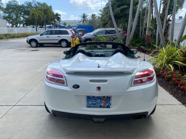2007 Polar White /Tan Saturn Sky LOW MILES 21,329 5 SPEED MANUAL (1G8MB35B47Y) with an 2.4L DOHC VVT I4 Aluminum Ecotec Engine engine, Manual transmission, located at 4701 North Dixie Hwy, Pompano Beach, FL, 33064, (954) 422-2889, 26.240938, -80.123474 - OUR WEBPAGE FLORIDACARS1.COM HAS OVER 100 PHOTOS AND FREE CARFAX LINK 2007 Saturn SKY 5 SPEED MANUAL Convertible 2.4L I4 F DOHC Gasoline 28 MPG Rear Wheel Drive Features ABS Brakes Air Conditioning Alloy Wheels AM/FM Stereo Auxiliary Audio Input CD Audio Cruise Control Leather Seats Manual Transmiss - Photo#90