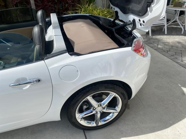 2007 Polar White /Tan Saturn Sky LOW MILES 21,329 5 SPEED MANUAL (1G8MB35B47Y) with an 2.4L DOHC VVT I4 Aluminum Ecotec Engine engine, Manual transmission, located at 4701 North Dixie Hwy, Pompano Beach, FL, 33064, (954) 422-2889, 26.240938, -80.123474 - OUR WEBPAGE FLORIDACARS1.COM HAS OVER 100 PHOTOS AND FREE CARFAX LINK 2007 Saturn SKY 5 SPEED MANUAL Convertible 2.4L I4 F DOHC Gasoline 28 MPG Rear Wheel Drive Features ABS Brakes Air Conditioning Alloy Wheels AM/FM Stereo Auxiliary Audio Input CD Audio Cruise Control Leather Seats Manual Transmiss - Photo#93