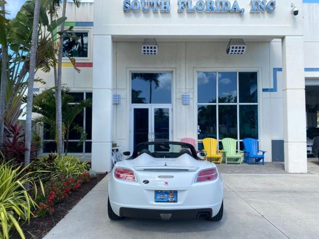 2007 Polar White /Tan Saturn Sky LOW MILES 21,329 5 SPEED MANUAL (1G8MB35B47Y) with an 2.4L DOHC VVT I4 Aluminum Ecotec Engine engine, Manual transmission, located at 4701 North Dixie Hwy, Pompano Beach, FL, 33064, (954) 422-2889, 26.240938, -80.123474 - OUR WEBPAGE FLORIDACARS1.COM HAS OVER 100 PHOTOS AND FREE CARFAX LINK 2007 Saturn SKY 5 SPEED MANUAL Convertible 2.4L I4 F DOHC Gasoline 28 MPG Rear Wheel Drive Features ABS Brakes Air Conditioning Alloy Wheels AM/FM Stereo Auxiliary Audio Input CD Audio Cruise Control Leather Seats Manual Transmiss - Photo#97