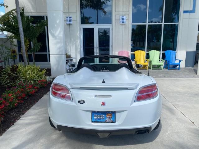 2007 Polar White /Tan Saturn Sky LOW MILES 21,329 5 SPEED MANUAL (1G8MB35B47Y) with an 2.4L DOHC VVT I4 Aluminum Ecotec Engine engine, Manual transmission, located at 4701 North Dixie Hwy, Pompano Beach, FL, 33064, (954) 422-2889, 26.240938, -80.123474 - OUR WEBPAGE FLORIDACARS1.COM HAS OVER 100 PHOTOS AND FREE CARFAX LINK 2007 Saturn SKY 5 SPEED MANUAL Convertible 2.4L I4 F DOHC Gasoline 28 MPG Rear Wheel Drive Features ABS Brakes Air Conditioning Alloy Wheels AM/FM Stereo Auxiliary Audio Input CD Audio Cruise Control Leather Seats Manual Transmiss - Photo#98