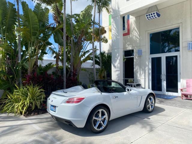 2007 Polar White /Tan Saturn Sky LOW MILES 21,329 5 SPEED MANUAL (1G8MB35B47Y) with an 2.4L DOHC VVT I4 Aluminum Ecotec Engine engine, Manual transmission, located at 4701 North Dixie Hwy, Pompano Beach, FL, 33064, (954) 422-2889, 26.240938, -80.123474 - OUR WEBPAGE FLORIDACARS1.COM HAS OVER 100 PHOTOS AND FREE CARFAX LINK 2007 Saturn SKY 5 SPEED MANUAL Convertible 2.4L I4 F DOHC Gasoline 28 MPG Rear Wheel Drive Features ABS Brakes Air Conditioning Alloy Wheels AM/FM Stereo Auxiliary Audio Input CD Audio Cruise Control Leather Seats Manual Transmiss - Photo#99