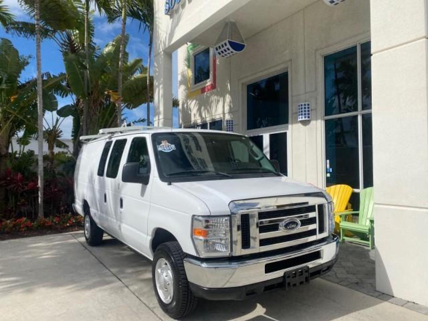 2014 Oxford White /Medium Flint Ford Econoline Cargo Van EXTENDED LOW MILES 6,380 1 OWNER (1FTNS1EW3ED) with an 4.6L EFI V8 FFV Capable Engine engine, Automatic transmission, located at 4701 North Dixie Hwy, Pompano Beach, FL, 33064, (954) 422-2889, 26.240938, -80.123474 - OUR WEBPAGE FLORIDACARS1.COM HAS OVER 100 PHOTOS AND FREE CARFAX LINK 2014 Ford E-Series E-150 1 OWNER Van 4.6L V8 F SOHC 16V Gasoline 16 MPG Rear Wheel Drive Features ABS Brakes Air Conditioning AM/FM Stereo Automatic Transmission Auxiliary Audio Input Barn Doors Power Locks Traction Control Vinyl - Photo#1