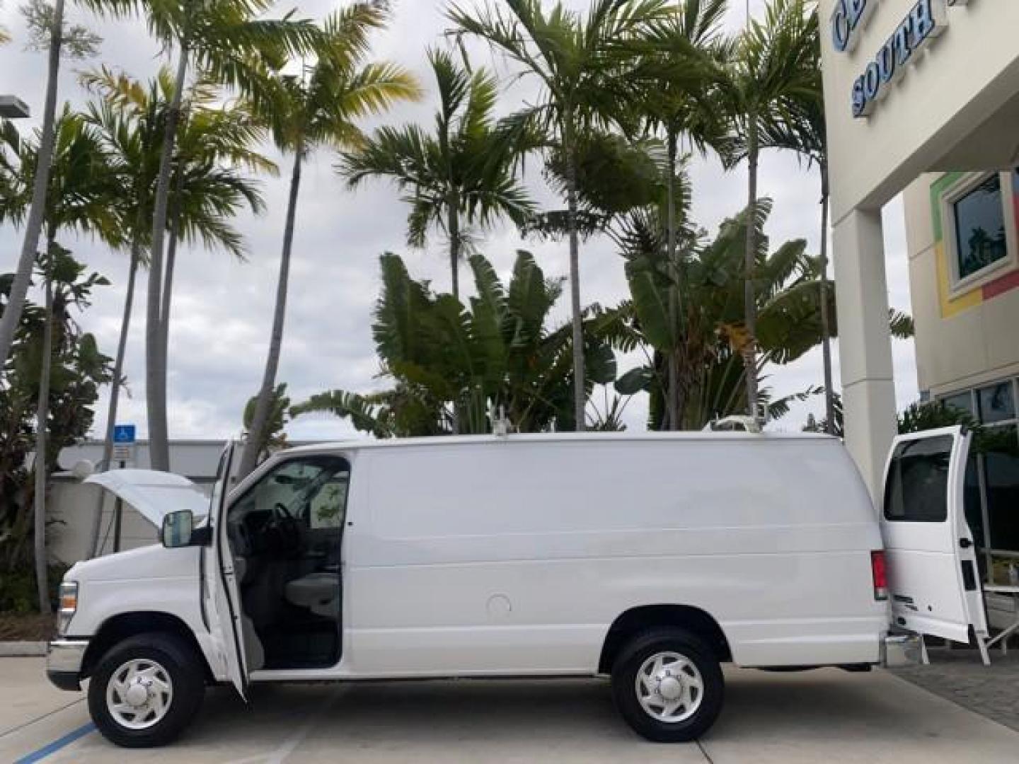 2014 Oxford White /Medium Flint Ford Econoline Cargo Van EXTENDED LOW MILES 6,380 1 OWNER (1FTNS1EW3ED) with an 4.6L EFI V8 FFV Capable Engine engine, Automatic transmission, located at 4701 North Dixie Hwy, Pompano Beach, FL, 33064, (954) 422-2889, 26.240938, -80.123474 - OUR WEBPAGE FLORIDACARS1.COM HAS OVER 100 PHOTOS AND FREE CARFAX LINK 2014 Ford E-Series E-150 1 OWNER Van 4.6L V8 F SOHC 16V Gasoline 16 MPG Rear Wheel Drive Features ABS Brakes Air Conditioning AM/FM Stereo Automatic Transmission Auxiliary Audio Input Barn Doors Power Locks Traction Control Vinyl - Photo#8