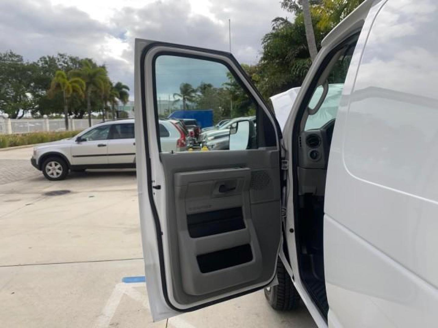 2014 Oxford White /Medium Flint Ford Econoline Cargo Van EXTENDED LOW MILES 6,380 1 OWNER (1FTNS1EW3ED) with an 4.6L EFI V8 FFV Capable Engine engine, Automatic transmission, located at 4701 North Dixie Hwy, Pompano Beach, FL, 33064, (954) 422-2889, 26.240938, -80.123474 - OUR WEBPAGE FLORIDACARS1.COM HAS OVER 100 PHOTOS AND FREE CARFAX LINK 2014 Ford E-Series E-150 1 OWNER Van 4.6L V8 F SOHC 16V Gasoline 16 MPG Rear Wheel Drive Features ABS Brakes Air Conditioning AM/FM Stereo Automatic Transmission Auxiliary Audio Input Barn Doors Power Locks Traction Control Vinyl - Photo#9