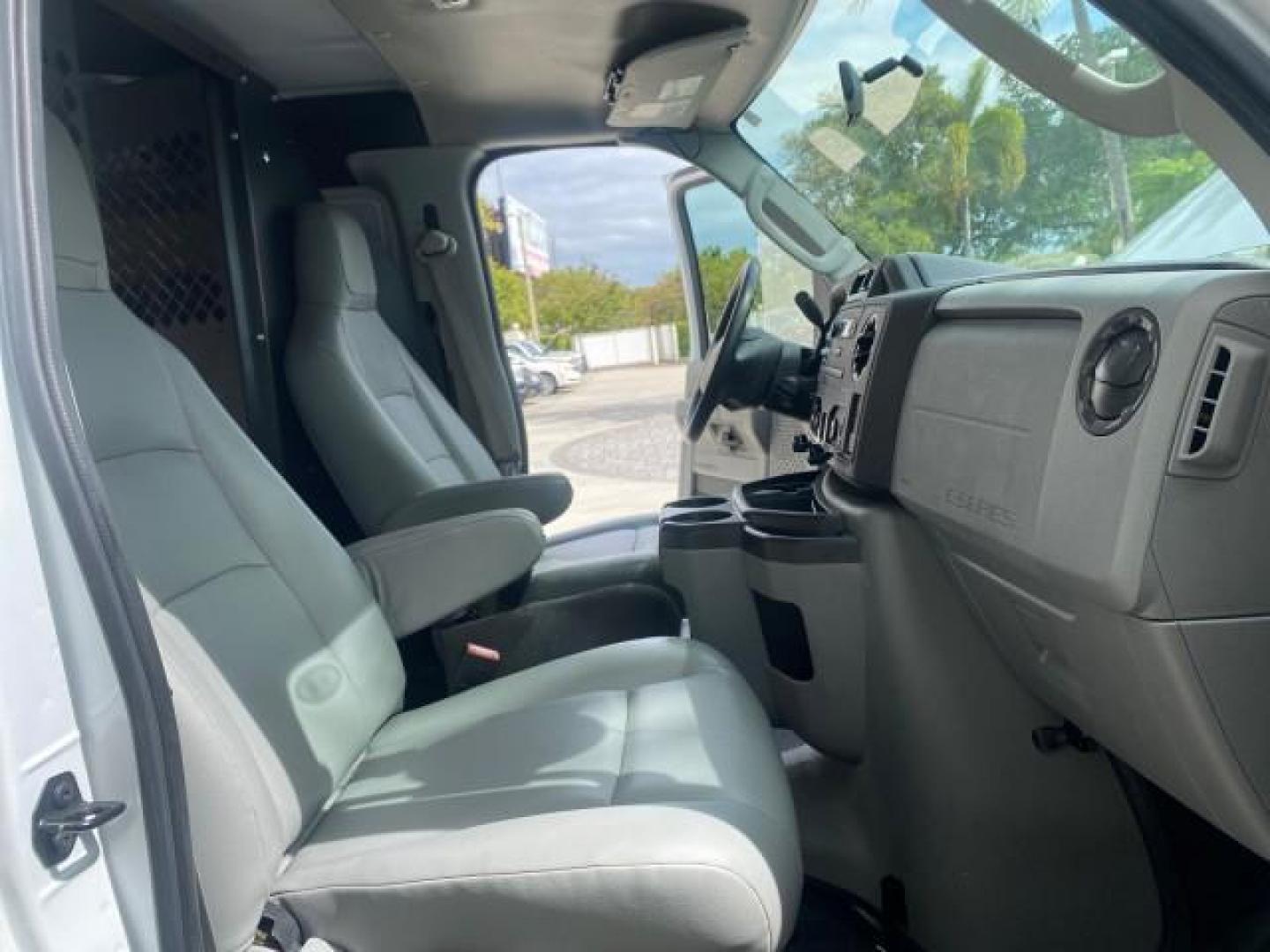 2014 Oxford White /Medium Flint Ford Econoline Cargo Van EXTENDED LOW MILES 6,380 1 OWNER (1FTNS1EW3ED) with an 4.6L EFI V8 FFV Capable Engine engine, Automatic transmission, located at 4701 North Dixie Hwy, Pompano Beach, FL, 33064, (954) 422-2889, 26.240938, -80.123474 - OUR WEBPAGE FLORIDACARS1.COM HAS OVER 100 PHOTOS AND FREE CARFAX LINK 2014 Ford E-Series E-150 1 OWNER Van 4.6L V8 F SOHC 16V Gasoline 16 MPG Rear Wheel Drive Features ABS Brakes Air Conditioning AM/FM Stereo Automatic Transmission Auxiliary Audio Input Barn Doors Power Locks Traction Control Vinyl - Photo#12