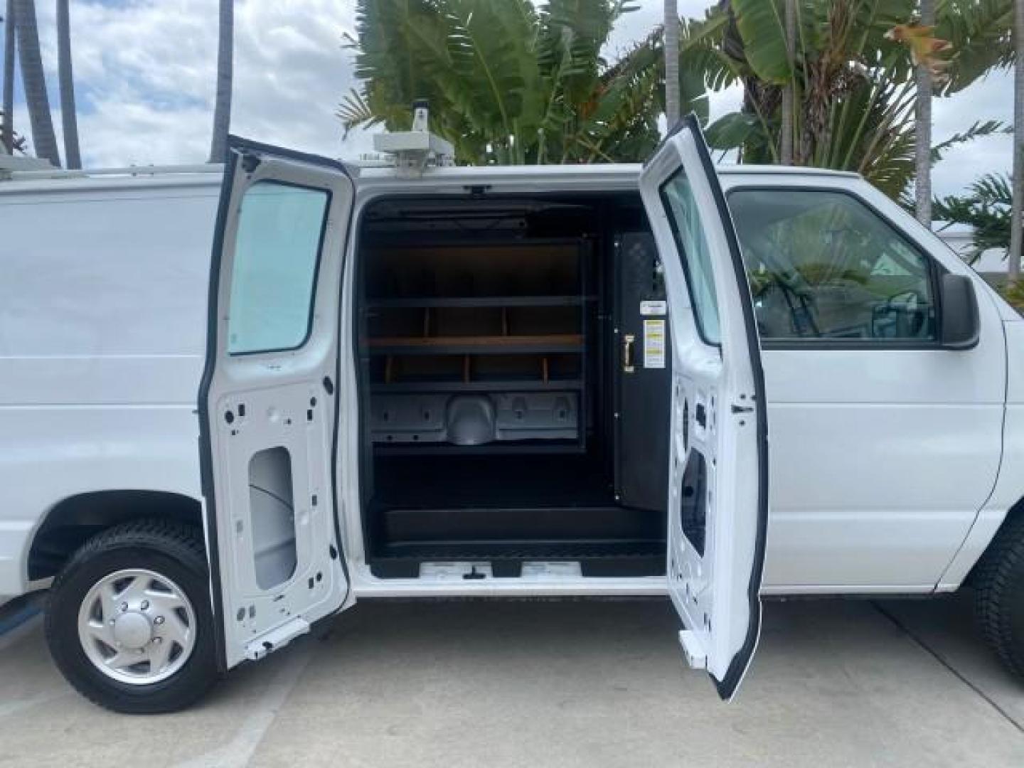 2014 Oxford White /Medium Flint Ford Econoline Cargo Van EXTENDED LOW MILES 6,380 1 OWNER (1FTNS1EW3ED) with an 4.6L EFI V8 FFV Capable Engine engine, Automatic transmission, located at 4701 North Dixie Hwy, Pompano Beach, FL, 33064, (954) 422-2889, 26.240938, -80.123474 - OUR WEBPAGE FLORIDACARS1.COM HAS OVER 100 PHOTOS AND FREE CARFAX LINK 2014 Ford E-Series E-150 1 OWNER Van 4.6L V8 F SOHC 16V Gasoline 16 MPG Rear Wheel Drive Features ABS Brakes Air Conditioning AM/FM Stereo Automatic Transmission Auxiliary Audio Input Barn Doors Power Locks Traction Control Vinyl - Photo#13