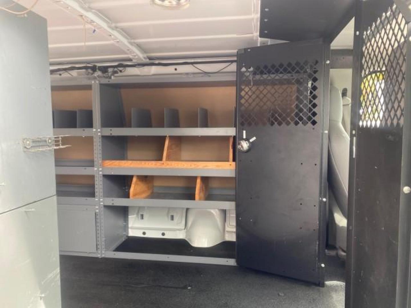 2014 Oxford White /Medium Flint Ford Econoline Cargo Van EXTENDED LOW MILES 6,380 1 OWNER (1FTNS1EW3ED) with an 4.6L EFI V8 FFV Capable Engine engine, Automatic transmission, located at 4701 North Dixie Hwy, Pompano Beach, FL, 33064, (954) 422-2889, 26.240938, -80.123474 - OUR WEBPAGE FLORIDACARS1.COM HAS OVER 100 PHOTOS AND FREE CARFAX LINK 2014 Ford E-Series E-150 1 OWNER Van 4.6L V8 F SOHC 16V Gasoline 16 MPG Rear Wheel Drive Features ABS Brakes Air Conditioning AM/FM Stereo Automatic Transmission Auxiliary Audio Input Barn Doors Power Locks Traction Control Vinyl - Photo#14