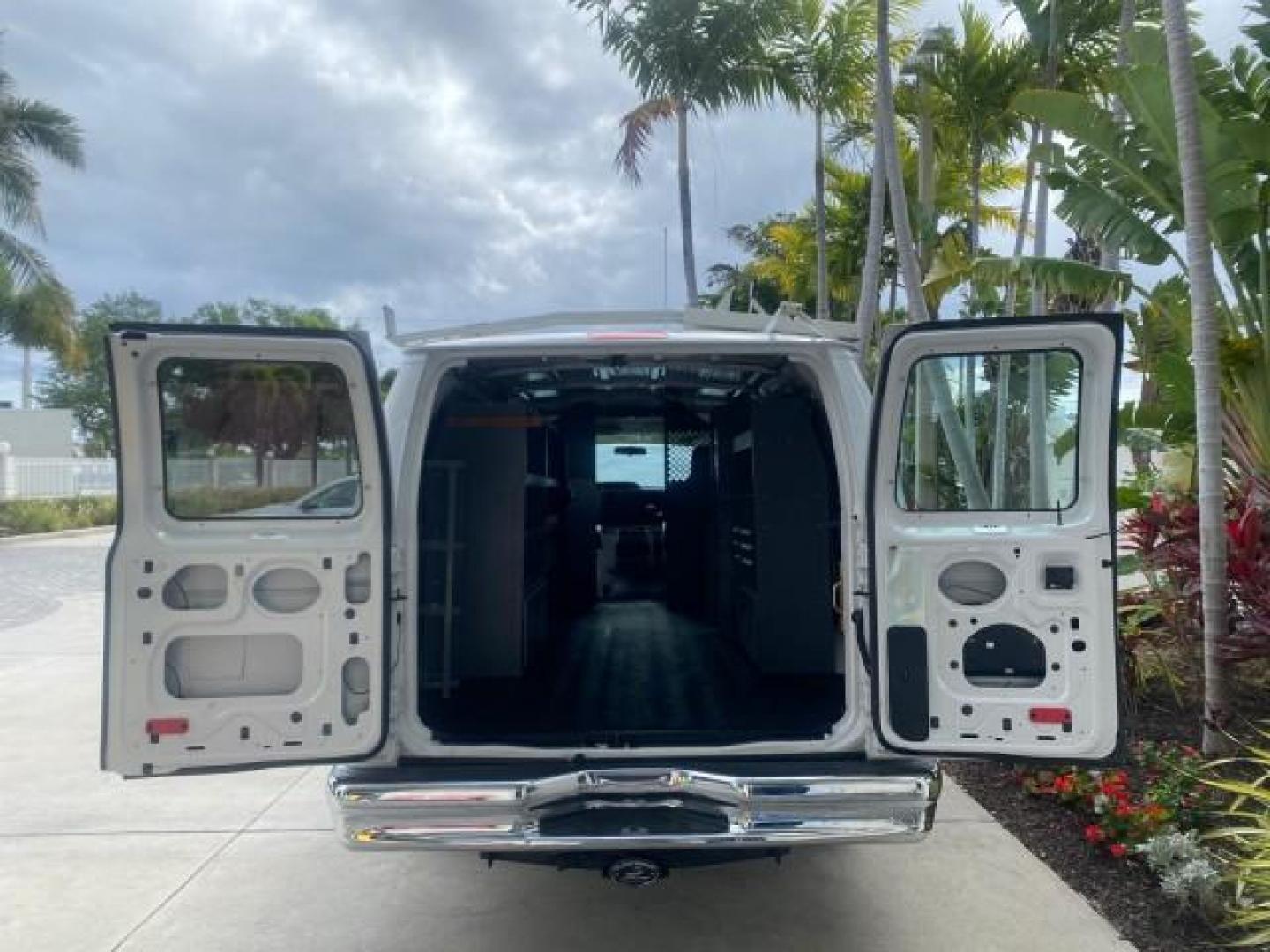 2014 Oxford White /Medium Flint Ford Econoline Cargo Van EXTENDED LOW MILES 6,380 1 OWNER (1FTNS1EW3ED) with an 4.6L EFI V8 FFV Capable Engine engine, Automatic transmission, located at 4701 North Dixie Hwy, Pompano Beach, FL, 33064, (954) 422-2889, 26.240938, -80.123474 - OUR WEBPAGE FLORIDACARS1.COM HAS OVER 100 PHOTOS AND FREE CARFAX LINK 2014 Ford E-Series E-150 1 OWNER Van 4.6L V8 F SOHC 16V Gasoline 16 MPG Rear Wheel Drive Features ABS Brakes Air Conditioning AM/FM Stereo Automatic Transmission Auxiliary Audio Input Barn Doors Power Locks Traction Control Vinyl - Photo#15