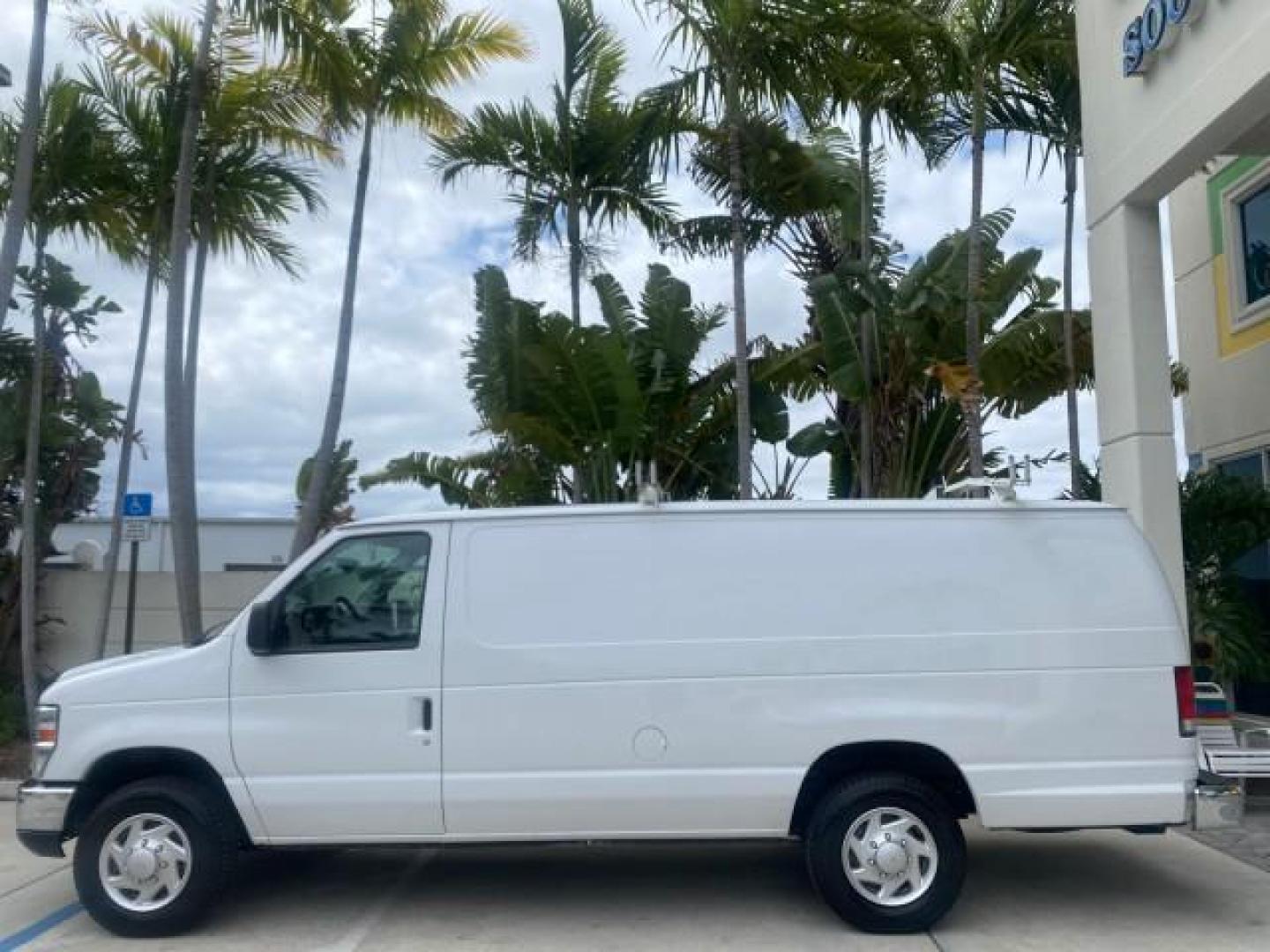 2014 Oxford White /Medium Flint Ford Econoline Cargo Van EXTENDED LOW MILES 6,380 1 OWNER (1FTNS1EW3ED) with an 4.6L EFI V8 FFV Capable Engine engine, Automatic transmission, located at 4701 North Dixie Hwy, Pompano Beach, FL, 33064, (954) 422-2889, 26.240938, -80.123474 - OUR WEBPAGE FLORIDACARS1.COM HAS OVER 100 PHOTOS AND FREE CARFAX LINK 2014 Ford E-Series E-150 1 OWNER Van 4.6L V8 F SOHC 16V Gasoline 16 MPG Rear Wheel Drive Features ABS Brakes Air Conditioning AM/FM Stereo Automatic Transmission Auxiliary Audio Input Barn Doors Power Locks Traction Control Vinyl - Photo#31