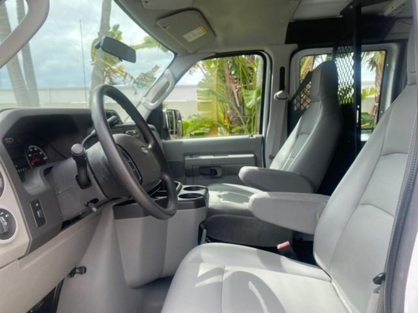 2014 Oxford White /Medium Flint Ford Econoline Cargo Van EXTENDED LOW MILES 6,380 1 OWNER (1FTNS1EW3ED) with an 4.6L EFI V8 FFV Capable Engine engine, Automatic transmission, located at 4701 North Dixie Hwy, Pompano Beach, FL, 33064, (954) 422-2889, 26.240938, -80.123474 - OUR WEBPAGE FLORIDACARS1.COM HAS OVER 100 PHOTOS AND FREE CARFAX LINK 2014 Ford E-Series E-150 1 OWNER Van 4.6L V8 F SOHC 16V Gasoline 16 MPG Rear Wheel Drive Features ABS Brakes Air Conditioning AM/FM Stereo Automatic Transmission Auxiliary Audio Input Barn Doors Power Locks Traction Control Vinyl - Photo#45