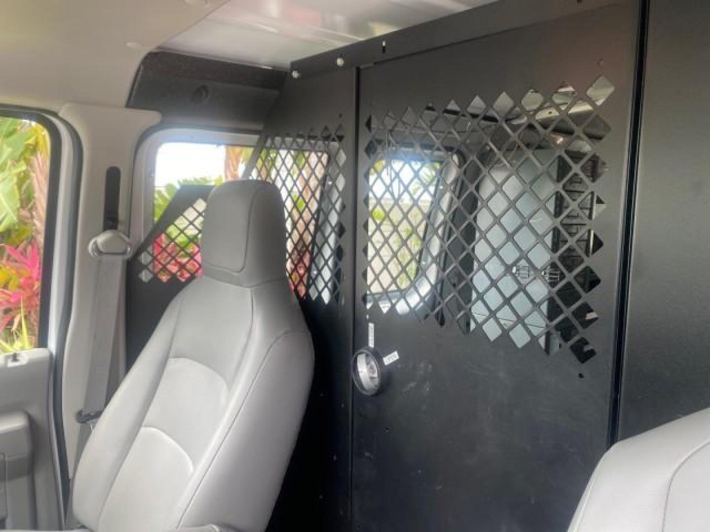 2014 Oxford White /Medium Flint Ford Econoline Cargo Van EXTENDED LOW MILES 6,380 1 OWNER (1FTNS1EW3ED) with an 4.6L EFI V8 FFV Capable Engine engine, Automatic transmission, located at 4701 North Dixie Hwy, Pompano Beach, FL, 33064, (954) 422-2889, 26.240938, -80.123474 - OUR WEBPAGE FLORIDACARS1.COM HAS OVER 100 PHOTOS AND FREE CARFAX LINK 2014 Ford E-Series E-150 1 OWNER Van 4.6L V8 F SOHC 16V Gasoline 16 MPG Rear Wheel Drive Features ABS Brakes Air Conditioning AM/FM Stereo Automatic Transmission Auxiliary Audio Input Barn Doors Power Locks Traction Control Vinyl - Photo#67