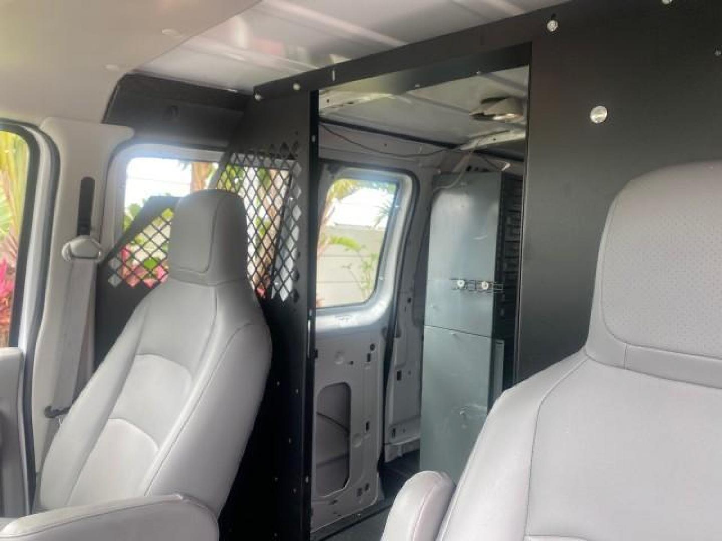 2014 Oxford White /Medium Flint Ford Econoline Cargo Van EXTENDED LOW MILES 6,380 1 OWNER (1FTNS1EW3ED) with an 4.6L EFI V8 FFV Capable Engine engine, Automatic transmission, located at 4701 North Dixie Hwy, Pompano Beach, FL, 33064, (954) 422-2889, 26.240938, -80.123474 - OUR WEBPAGE FLORIDACARS1.COM HAS OVER 100 PHOTOS AND FREE CARFAX LINK 2014 Ford E-Series E-150 1 OWNER Van 4.6L V8 F SOHC 16V Gasoline 16 MPG Rear Wheel Drive Features ABS Brakes Air Conditioning AM/FM Stereo Automatic Transmission Auxiliary Audio Input Barn Doors Power Locks Traction Control Vinyl - Photo#70