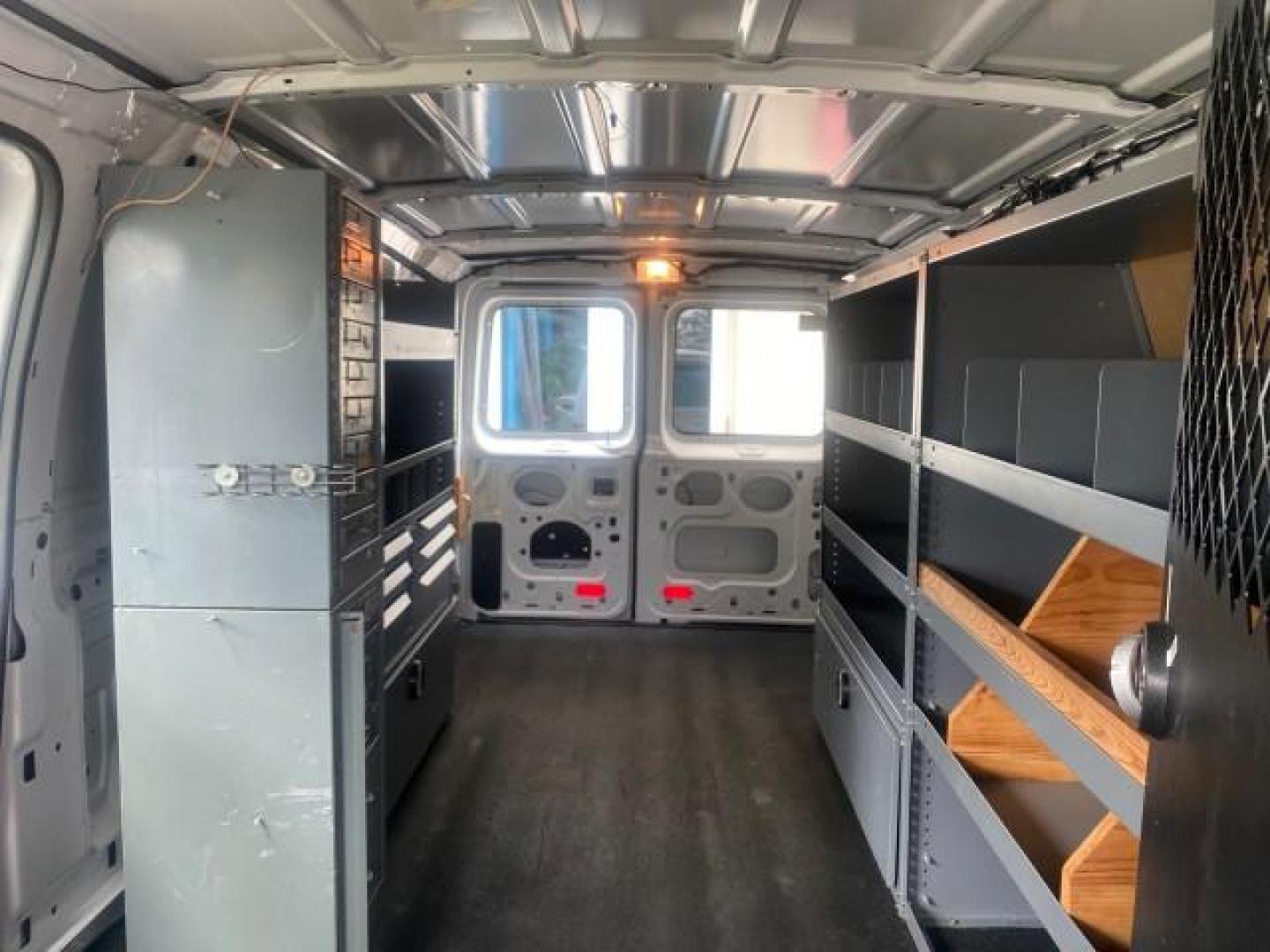 2014 Oxford White /Medium Flint Ford Econoline Cargo Van EXTENDED LOW MILES 6,380 1 OWNER (1FTNS1EW3ED) with an 4.6L EFI V8 FFV Capable Engine engine, Automatic transmission, located at 4701 North Dixie Hwy, Pompano Beach, FL, 33064, (954) 422-2889, 26.240938, -80.123474 - OUR WEBPAGE FLORIDACARS1.COM HAS OVER 100 PHOTOS AND FREE CARFAX LINK 2014 Ford E-Series E-150 1 OWNER Van 4.6L V8 F SOHC 16V Gasoline 16 MPG Rear Wheel Drive Features ABS Brakes Air Conditioning AM/FM Stereo Automatic Transmission Auxiliary Audio Input Barn Doors Power Locks Traction Control Vinyl - Photo#71