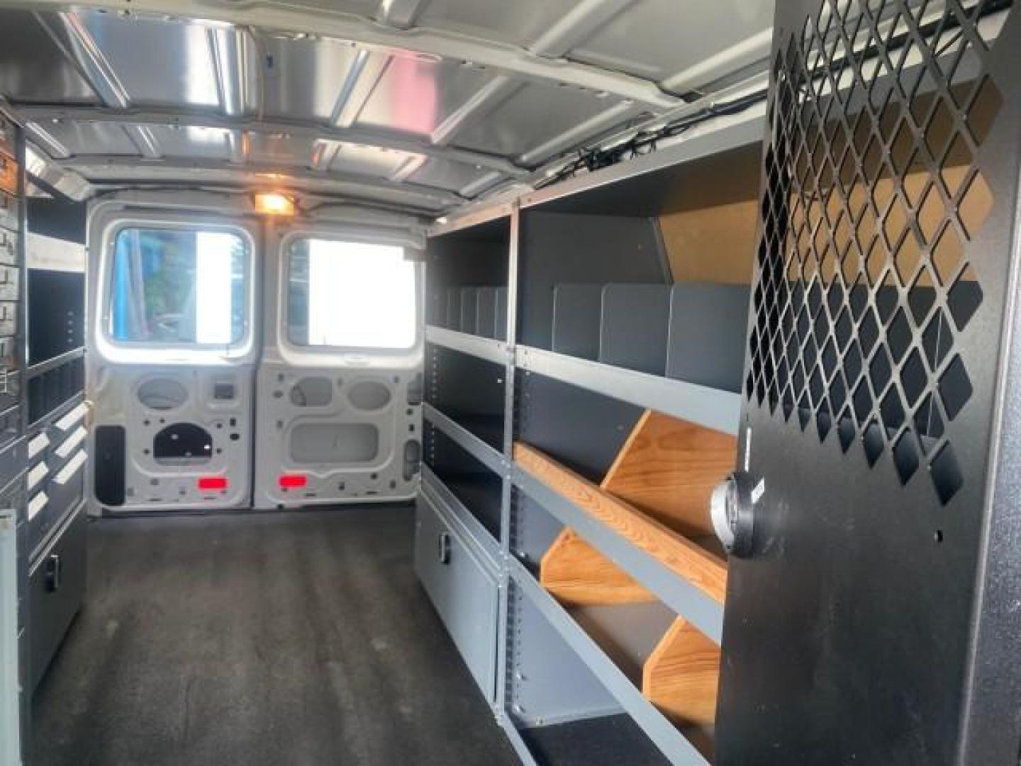 2014 Oxford White /Medium Flint Ford Econoline Cargo Van EXTENDED LOW MILES 6,380 1 OWNER (1FTNS1EW3ED) with an 4.6L EFI V8 FFV Capable Engine engine, Automatic transmission, located at 4701 North Dixie Hwy, Pompano Beach, FL, 33064, (954) 422-2889, 26.240938, -80.123474 - OUR WEBPAGE FLORIDACARS1.COM HAS OVER 100 PHOTOS AND FREE CARFAX LINK 2014 Ford E-Series E-150 1 OWNER Van 4.6L V8 F SOHC 16V Gasoline 16 MPG Rear Wheel Drive Features ABS Brakes Air Conditioning AM/FM Stereo Automatic Transmission Auxiliary Audio Input Barn Doors Power Locks Traction Control Vinyl - Photo#72