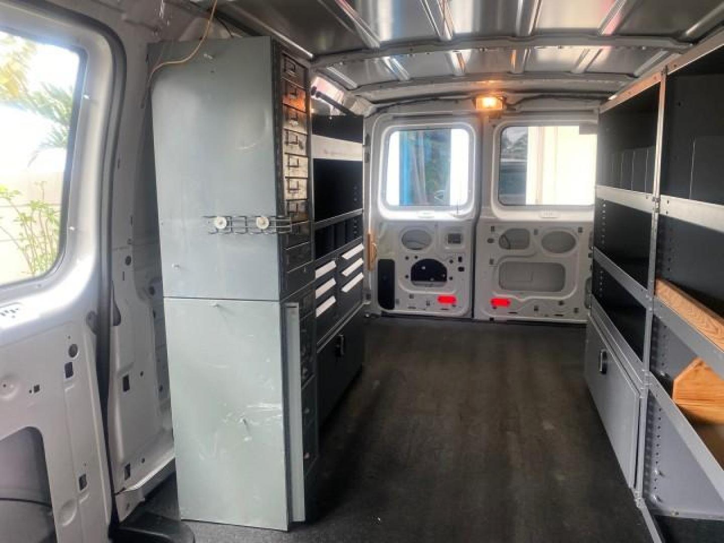 2014 Oxford White /Medium Flint Ford Econoline Cargo Van EXTENDED LOW MILES 6,380 1 OWNER (1FTNS1EW3ED) with an 4.6L EFI V8 FFV Capable Engine engine, Automatic transmission, located at 4701 North Dixie Hwy, Pompano Beach, FL, 33064, (954) 422-2889, 26.240938, -80.123474 - OUR WEBPAGE FLORIDACARS1.COM HAS OVER 100 PHOTOS AND FREE CARFAX LINK 2014 Ford E-Series E-150 1 OWNER Van 4.6L V8 F SOHC 16V Gasoline 16 MPG Rear Wheel Drive Features ABS Brakes Air Conditioning AM/FM Stereo Automatic Transmission Auxiliary Audio Input Barn Doors Power Locks Traction Control Vinyl - Photo#73