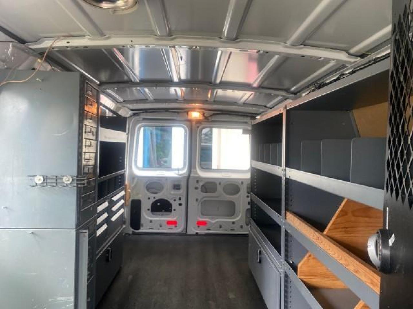2014 Oxford White /Medium Flint Ford Econoline Cargo Van EXTENDED LOW MILES 6,380 1 OWNER (1FTNS1EW3ED) with an 4.6L EFI V8 FFV Capable Engine engine, Automatic transmission, located at 4701 North Dixie Hwy, Pompano Beach, FL, 33064, (954) 422-2889, 26.240938, -80.123474 - OUR WEBPAGE FLORIDACARS1.COM HAS OVER 100 PHOTOS AND FREE CARFAX LINK 2014 Ford E-Series E-150 1 OWNER Van 4.6L V8 F SOHC 16V Gasoline 16 MPG Rear Wheel Drive Features ABS Brakes Air Conditioning AM/FM Stereo Automatic Transmission Auxiliary Audio Input Barn Doors Power Locks Traction Control Vinyl - Photo#74