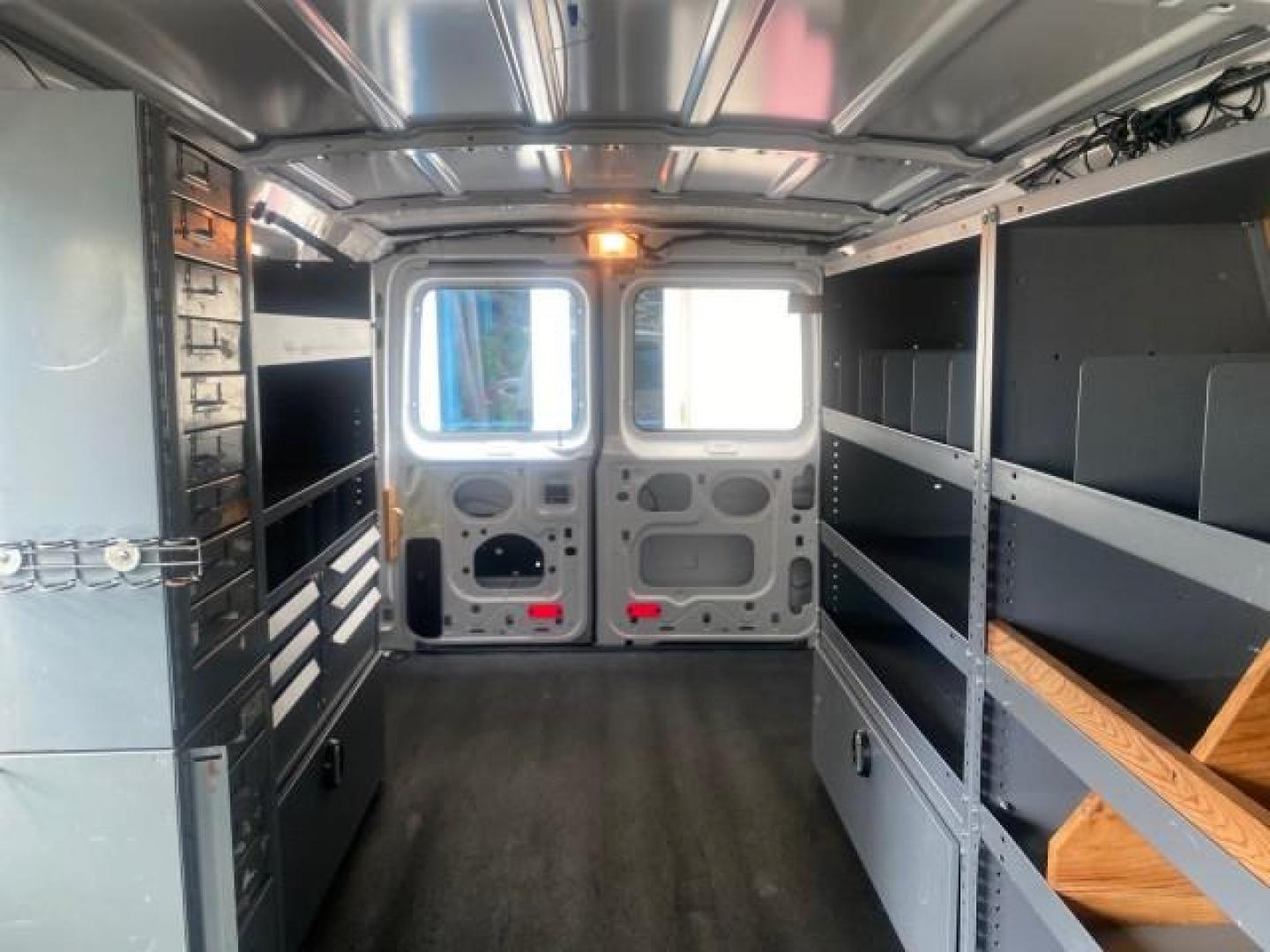 2014 Oxford White /Medium Flint Ford Econoline Cargo Van EXTENDED LOW MILES 6,380 1 OWNER (1FTNS1EW3ED) with an 4.6L EFI V8 FFV Capable Engine engine, Automatic transmission, located at 4701 North Dixie Hwy, Pompano Beach, FL, 33064, (954) 422-2889, 26.240938, -80.123474 - OUR WEBPAGE FLORIDACARS1.COM HAS OVER 100 PHOTOS AND FREE CARFAX LINK 2014 Ford E-Series E-150 1 OWNER Van 4.6L V8 F SOHC 16V Gasoline 16 MPG Rear Wheel Drive Features ABS Brakes Air Conditioning AM/FM Stereo Automatic Transmission Auxiliary Audio Input Barn Doors Power Locks Traction Control Vinyl - Photo#75