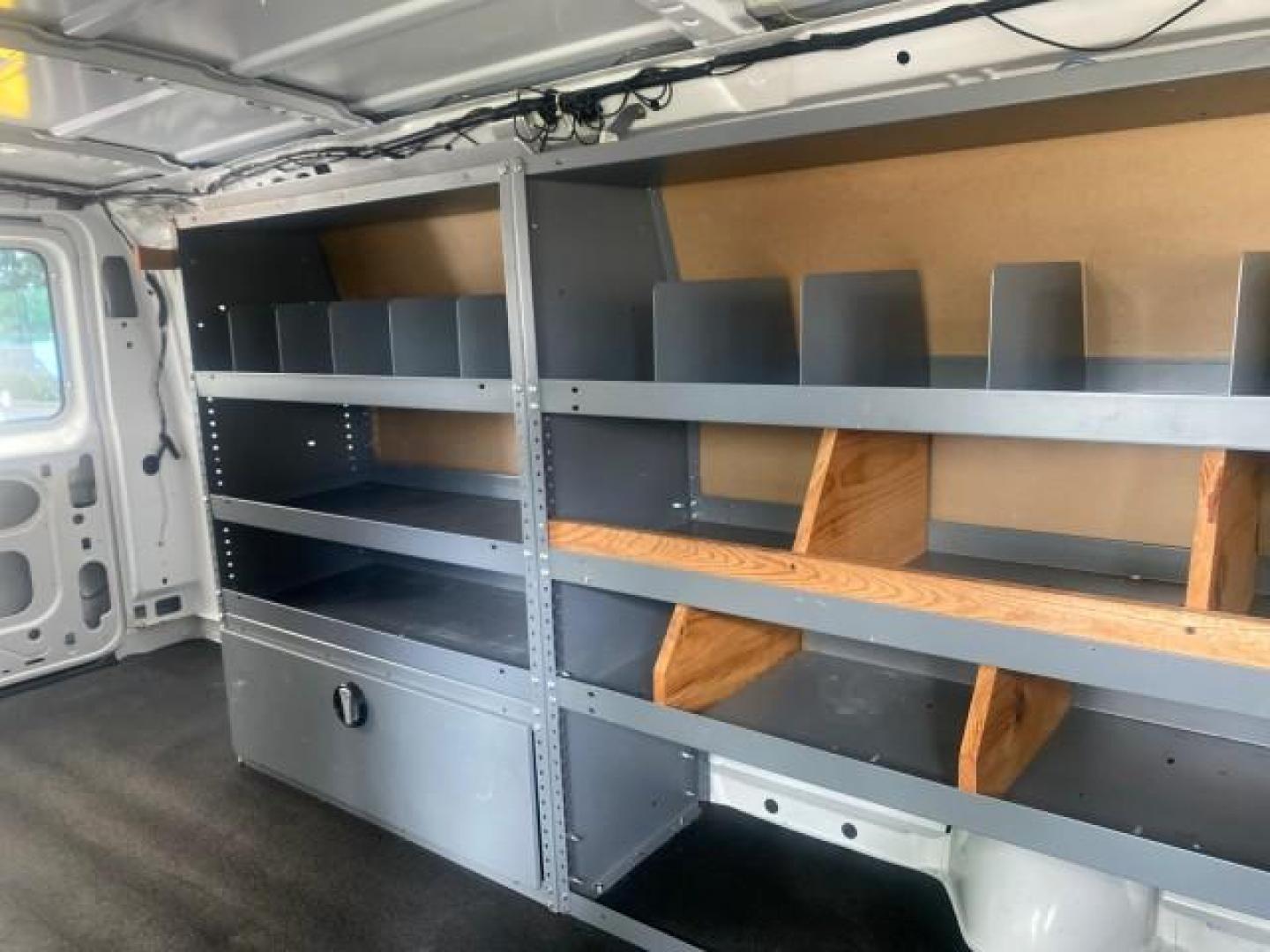 2014 Oxford White /Medium Flint Ford Econoline Cargo Van EXTENDED LOW MILES 6,380 1 OWNER (1FTNS1EW3ED) with an 4.6L EFI V8 FFV Capable Engine engine, Automatic transmission, located at 4701 North Dixie Hwy, Pompano Beach, FL, 33064, (954) 422-2889, 26.240938, -80.123474 - OUR WEBPAGE FLORIDACARS1.COM HAS OVER 100 PHOTOS AND FREE CARFAX LINK 2014 Ford E-Series E-150 1 OWNER Van 4.6L V8 F SOHC 16V Gasoline 16 MPG Rear Wheel Drive Features ABS Brakes Air Conditioning AM/FM Stereo Automatic Transmission Auxiliary Audio Input Barn Doors Power Locks Traction Control Vinyl - Photo#76