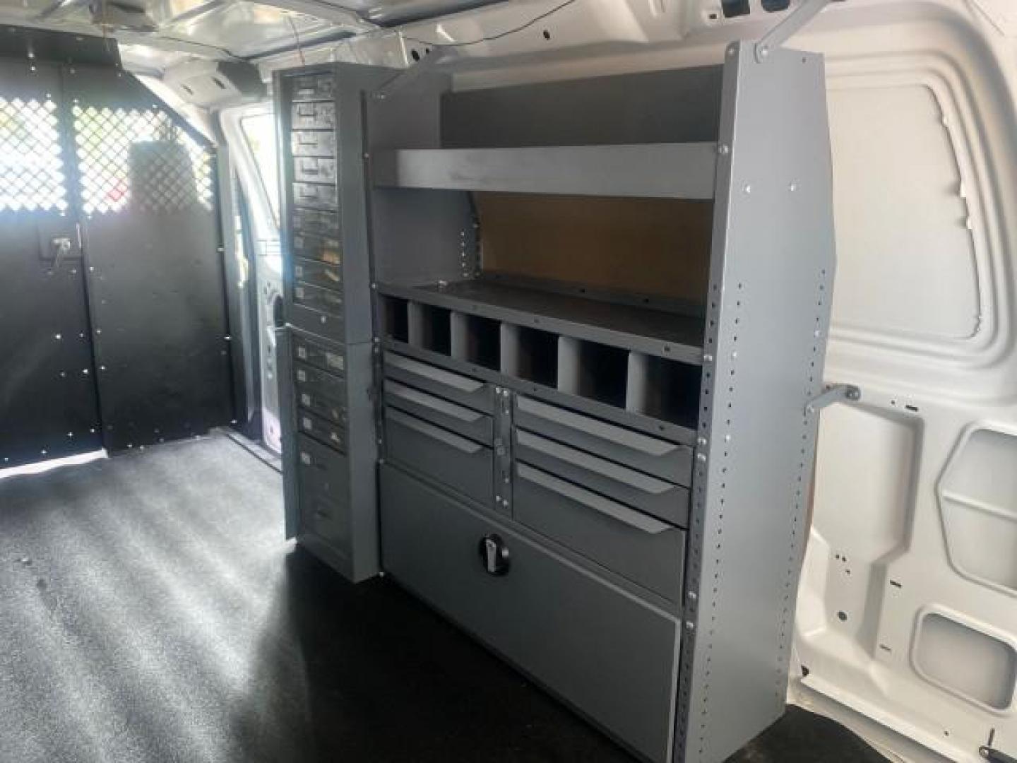 2014 Oxford White /Medium Flint Ford Econoline Cargo Van EXTENDED LOW MILES 6,380 1 OWNER (1FTNS1EW3ED) with an 4.6L EFI V8 FFV Capable Engine engine, Automatic transmission, located at 4701 North Dixie Hwy, Pompano Beach, FL, 33064, (954) 422-2889, 26.240938, -80.123474 - OUR WEBPAGE FLORIDACARS1.COM HAS OVER 100 PHOTOS AND FREE CARFAX LINK 2014 Ford E-Series E-150 1 OWNER Van 4.6L V8 F SOHC 16V Gasoline 16 MPG Rear Wheel Drive Features ABS Brakes Air Conditioning AM/FM Stereo Automatic Transmission Auxiliary Audio Input Barn Doors Power Locks Traction Control Vinyl - Photo#82