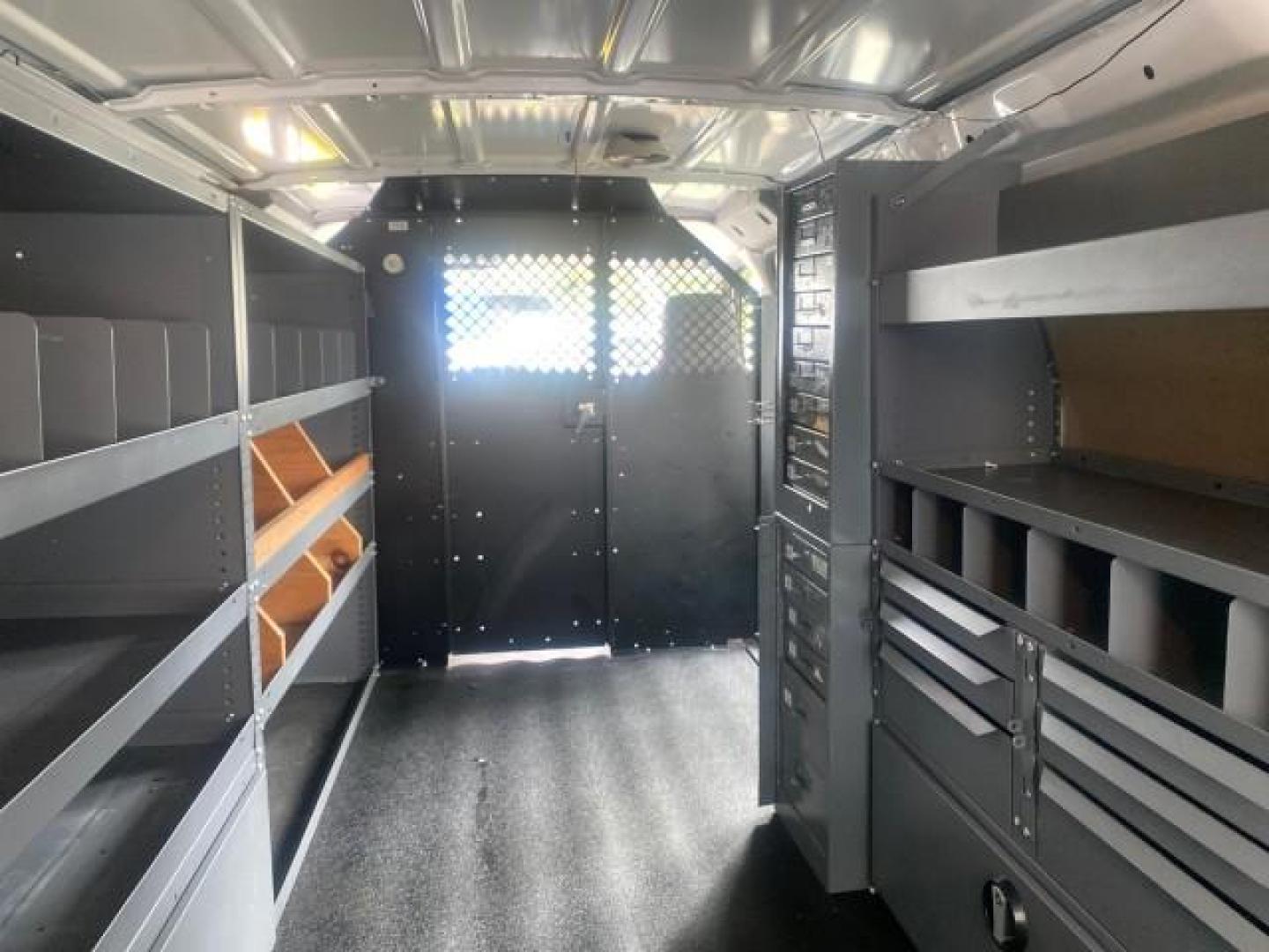 2014 Oxford White /Medium Flint Ford Econoline Cargo Van EXTENDED LOW MILES 6,380 1 OWNER (1FTNS1EW3ED) with an 4.6L EFI V8 FFV Capable Engine engine, Automatic transmission, located at 4701 North Dixie Hwy, Pompano Beach, FL, 33064, (954) 422-2889, 26.240938, -80.123474 - OUR WEBPAGE FLORIDACARS1.COM HAS OVER 100 PHOTOS AND FREE CARFAX LINK 2014 Ford E-Series E-150 1 OWNER Van 4.6L V8 F SOHC 16V Gasoline 16 MPG Rear Wheel Drive Features ABS Brakes Air Conditioning AM/FM Stereo Automatic Transmission Auxiliary Audio Input Barn Doors Power Locks Traction Control Vinyl - Photo#83