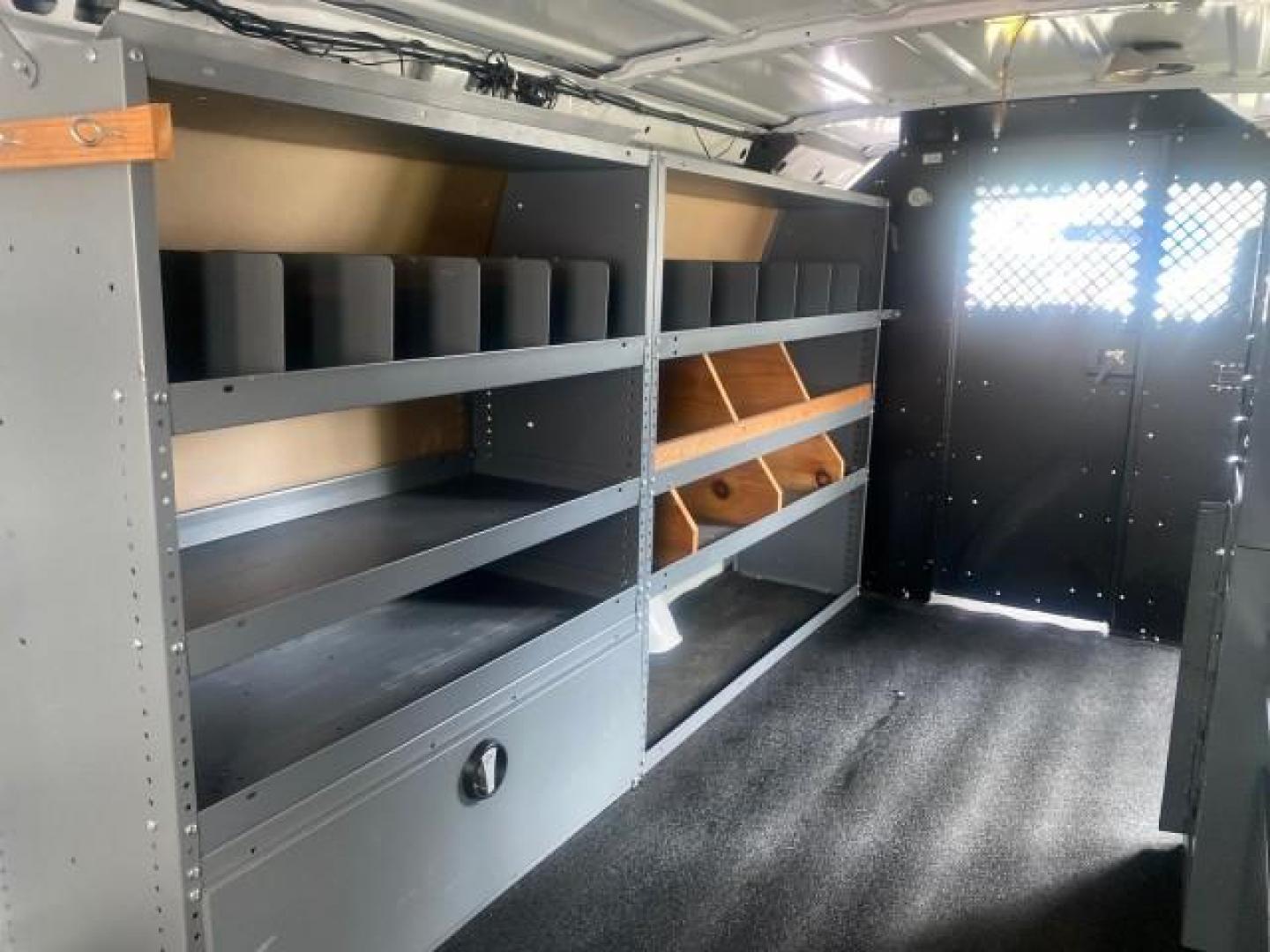 2014 Oxford White /Medium Flint Ford Econoline Cargo Van EXTENDED LOW MILES 6,380 1 OWNER (1FTNS1EW3ED) with an 4.6L EFI V8 FFV Capable Engine engine, Automatic transmission, located at 4701 North Dixie Hwy, Pompano Beach, FL, 33064, (954) 422-2889, 26.240938, -80.123474 - OUR WEBPAGE FLORIDACARS1.COM HAS OVER 100 PHOTOS AND FREE CARFAX LINK 2014 Ford E-Series E-150 1 OWNER Van 4.6L V8 F SOHC 16V Gasoline 16 MPG Rear Wheel Drive Features ABS Brakes Air Conditioning AM/FM Stereo Automatic Transmission Auxiliary Audio Input Barn Doors Power Locks Traction Control Vinyl - Photo#85