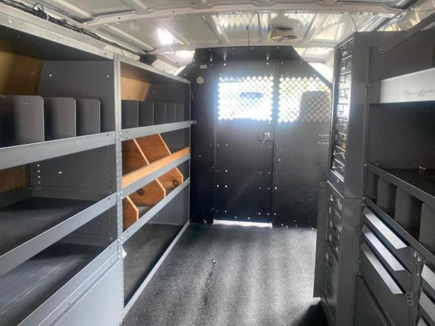 2014 Oxford White /Medium Flint Ford Econoline Cargo Van EXTENDED LOW MILES 6,380 1 OWNER (1FTNS1EW3ED) with an 4.6L EFI V8 FFV Capable Engine engine, Automatic transmission, located at 4701 North Dixie Hwy, Pompano Beach, FL, 33064, (954) 422-2889, 26.240938, -80.123474 - OUR WEBPAGE FLORIDACARS1.COM HAS OVER 100 PHOTOS AND FREE CARFAX LINK 2014 Ford E-Series E-150 1 OWNER Van 4.6L V8 F SOHC 16V Gasoline 16 MPG Rear Wheel Drive Features ABS Brakes Air Conditioning AM/FM Stereo Automatic Transmission Auxiliary Audio Input Barn Doors Power Locks Traction Control Vinyl - Photo#86