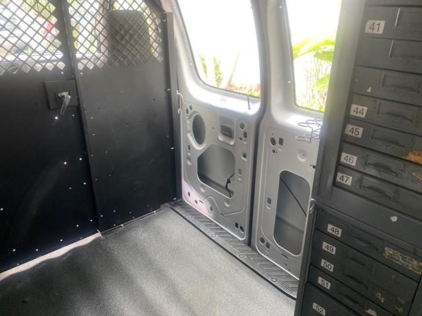 2014 Oxford White /Medium Flint Ford Econoline Cargo Van EXTENDED LOW MILES 6,380 1 OWNER (1FTNS1EW3ED) with an 4.6L EFI V8 FFV Capable Engine engine, Automatic transmission, located at 4701 North Dixie Hwy, Pompano Beach, FL, 33064, (954) 422-2889, 26.240938, -80.123474 - OUR WEBPAGE FLORIDACARS1.COM HAS OVER 100 PHOTOS AND FREE CARFAX LINK 2014 Ford E-Series E-150 1 OWNER Van 4.6L V8 F SOHC 16V Gasoline 16 MPG Rear Wheel Drive Features ABS Brakes Air Conditioning AM/FM Stereo Automatic Transmission Auxiliary Audio Input Barn Doors Power Locks Traction Control Vinyl - Photo#89