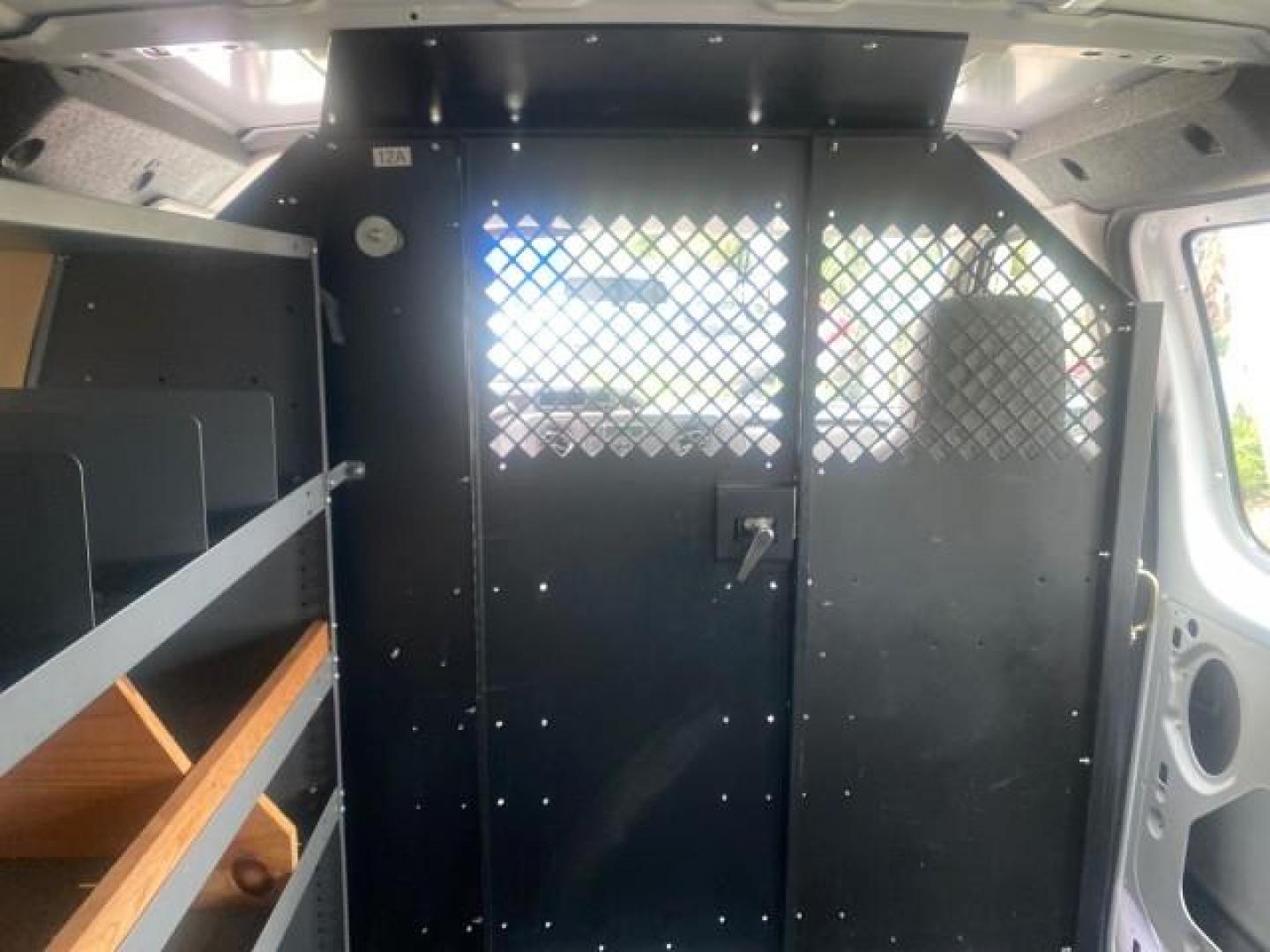 2014 Oxford White /Medium Flint Ford Econoline Cargo Van EXTENDED LOW MILES 6,380 1 OWNER (1FTNS1EW3ED) with an 4.6L EFI V8 FFV Capable Engine engine, Automatic transmission, located at 4701 North Dixie Hwy, Pompano Beach, FL, 33064, (954) 422-2889, 26.240938, -80.123474 - OUR WEBPAGE FLORIDACARS1.COM HAS OVER 100 PHOTOS AND FREE CARFAX LINK 2014 Ford E-Series E-150 1 OWNER Van 4.6L V8 F SOHC 16V Gasoline 16 MPG Rear Wheel Drive Features ABS Brakes Air Conditioning AM/FM Stereo Automatic Transmission Auxiliary Audio Input Barn Doors Power Locks Traction Control Vinyl - Photo#91