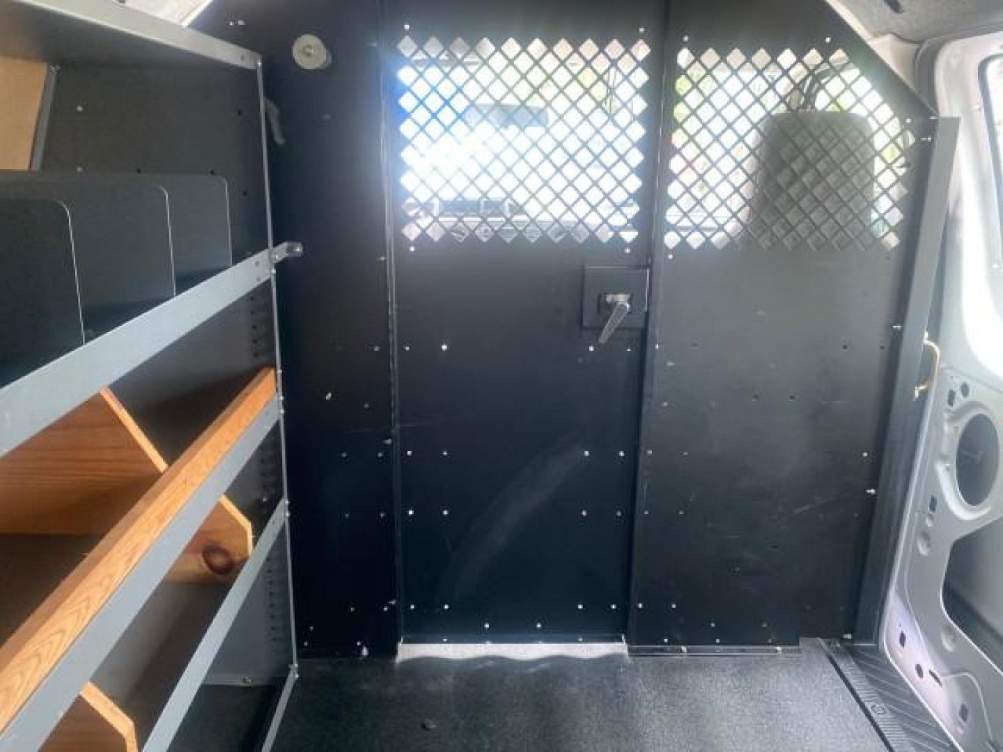 2014 Oxford White /Medium Flint Ford Econoline Cargo Van EXTENDED LOW MILES 6,380 1 OWNER (1FTNS1EW3ED) with an 4.6L EFI V8 FFV Capable Engine engine, Automatic transmission, located at 4701 North Dixie Hwy, Pompano Beach, FL, 33064, (954) 422-2889, 26.240938, -80.123474 - OUR WEBPAGE FLORIDACARS1.COM HAS OVER 100 PHOTOS AND FREE CARFAX LINK 2014 Ford E-Series E-150 1 OWNER Van 4.6L V8 F SOHC 16V Gasoline 16 MPG Rear Wheel Drive Features ABS Brakes Air Conditioning AM/FM Stereo Automatic Transmission Auxiliary Audio Input Barn Doors Power Locks Traction Control Vinyl - Photo#92